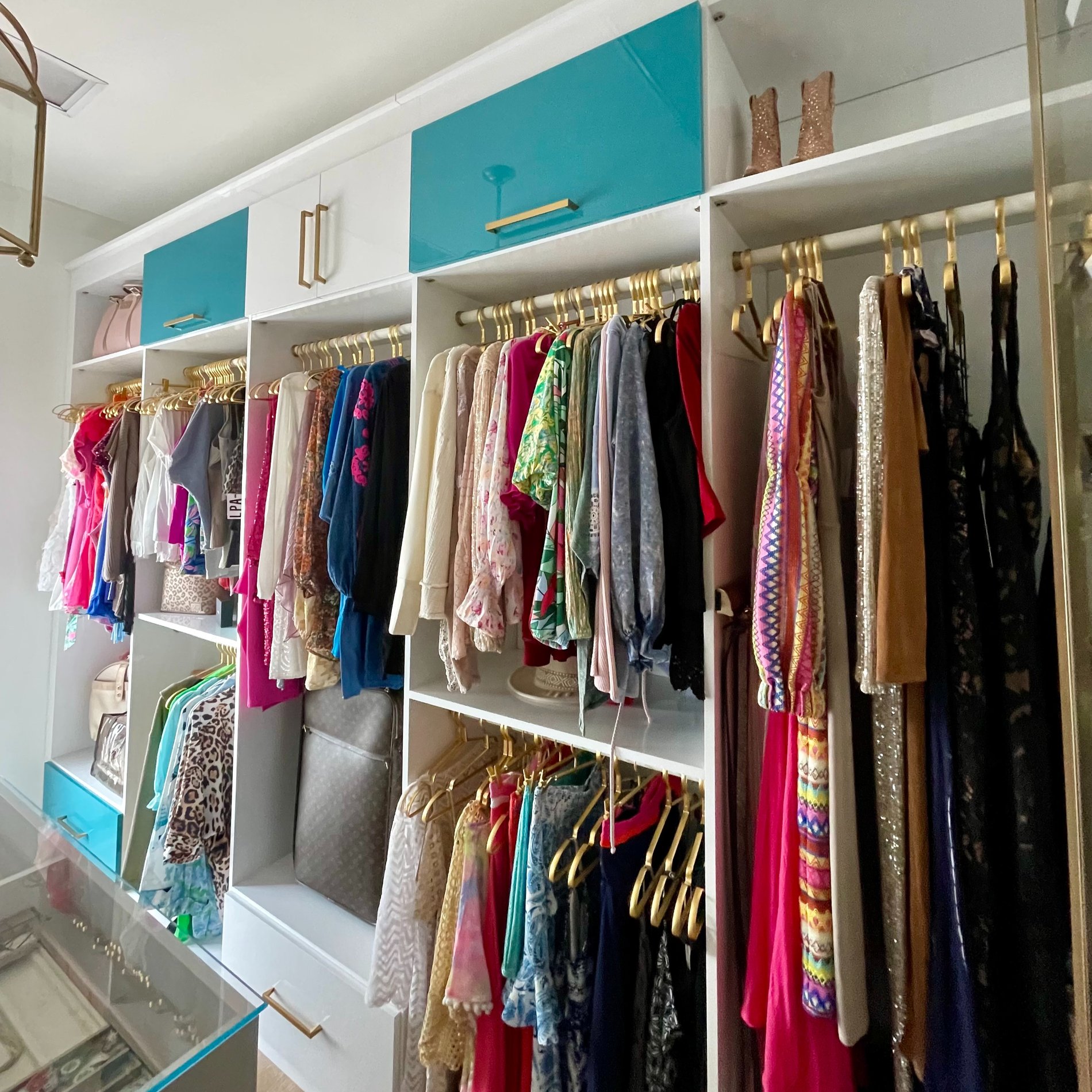 Glossy blue and white closet shelving for custom organization Pensacola & Panama City, Florida