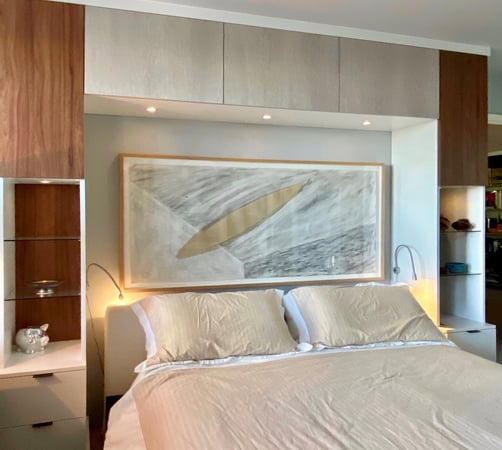 bed surround with cabinets and drawers for storage