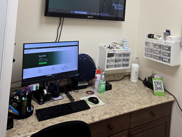 Interior photo of the hearing consultation office desk for AudioNova hearing clinic in Bushnell, FL