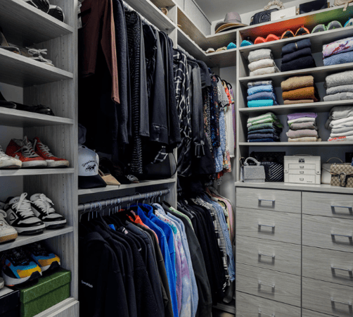 gray modern walk-in closet her side with double hanging, shoe wall, shelving for sweaters and drawers Brooklyn New York City