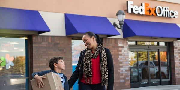 Women and son leaving FedEx Office