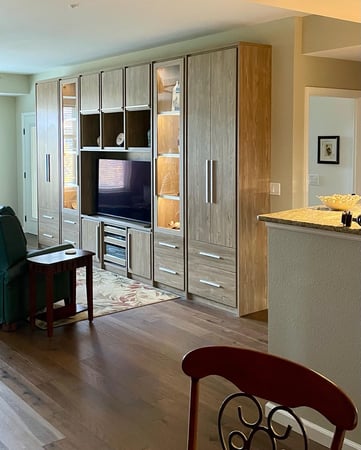 Brown media center with lighting, drawers and doors