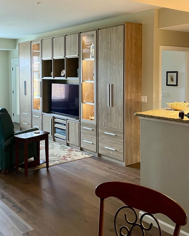 Brown media center with lighting, drawers and doors