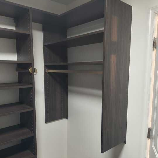 Virginia Beach - Custom closets - Modern dark wood closet with open shelving and hanging rods.
