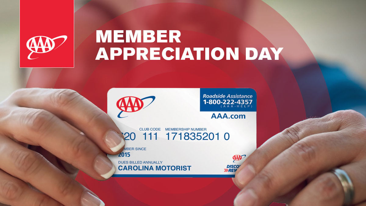 Man and Woman holding AAA card