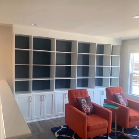 Richmond - Custom closets - Built-in shelving unit across the wall with cabinets along the bottom