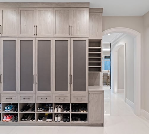 Custom mudroom closets with built-in closet systems, featuring cabinets, shoe storage, entryway storage and drawers for organized closet organization and storage solutions in Orchard Lake, Michigan