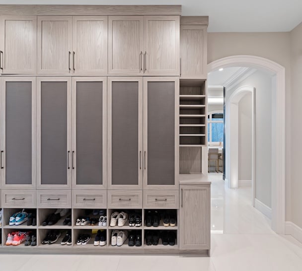 Custom mudroom closets with built-in closet systems, featuring cabinets, shoe storage, entryway storage and drawers for organized closet organization and storage solutions in Orchard Lake, Michigan