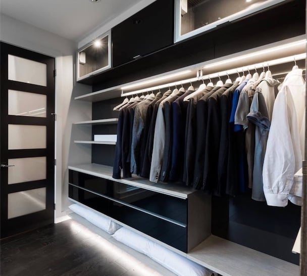 custom virtuoso walk in closet with ribbon lighting and acrylic drawers