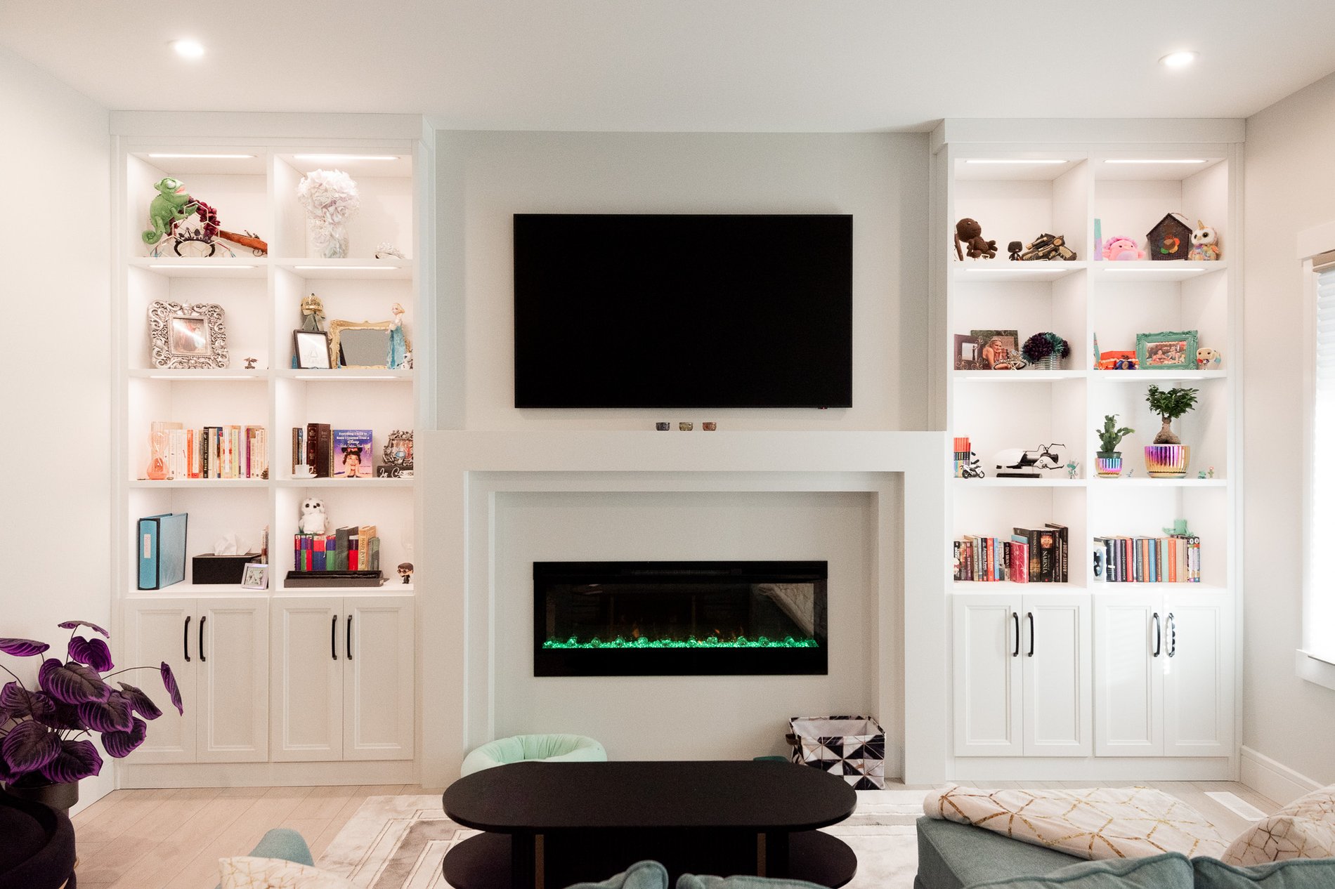 White media centre and library shelves.