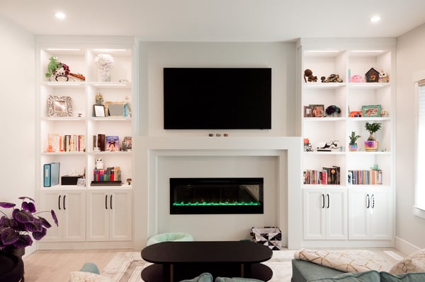 White media centre and library shelves.