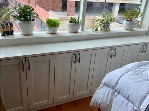 Richmond - Custom closets - Built-in floor cabinets under a window sill