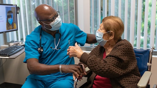 Photo: Dr. Kabongo with patient, Christina Anella