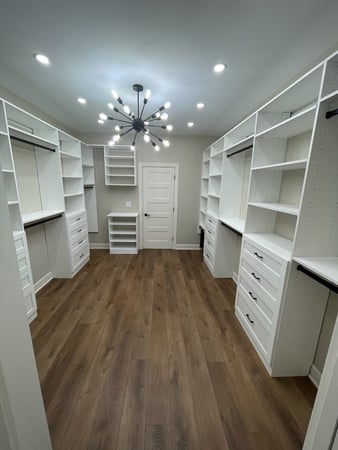 white walk in closet with black accents