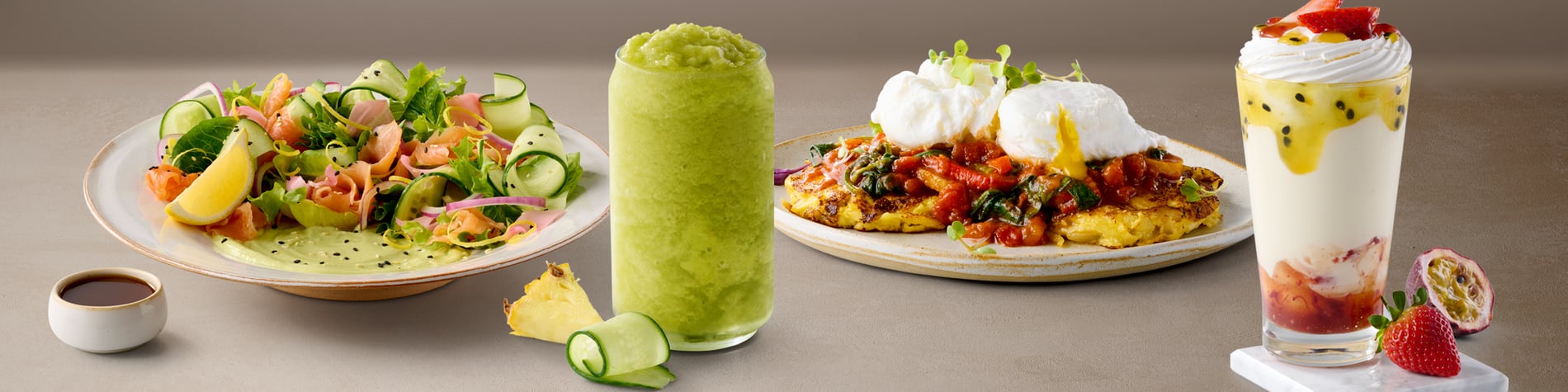 A range of delicious choices from the Mugg & Bean restaurant menu including a Smoked Trout Fresh Salad, Cucumber & Pineapple Slush, a Sweet Potato Hash vegetarian breakfast, and a Passion Pavlova Summer Shake.