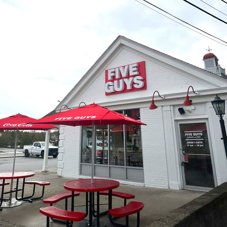 Exterior photograph of the entrance to the Five Guys at 170 Bath Road in Brunswick, Maine.
