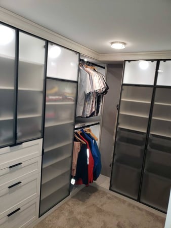 Frosted Glass drawers in walk-in closet shelves.