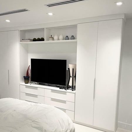 White wardrobe with drawers and entertainment center