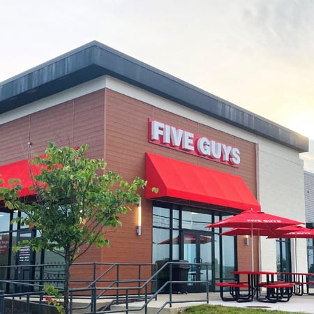 Exterior photograph of the Five Guys restaurant at 4014 Connection Point Boulevard in Charlotte, North Carolina.