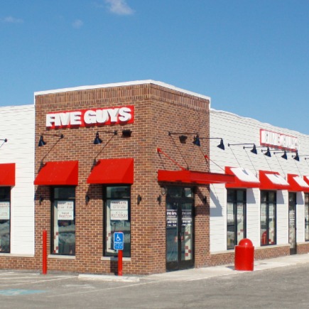 Exterior photograph of the Five Guys restaurant located at 7622 Richmond Highway in Alexandria, Virginia.