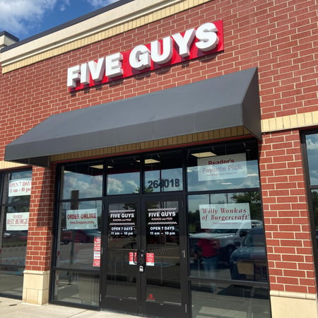 Exterior photograph of the Five Guys restaurant at 26401 Novi Road in Novi, Michigan.