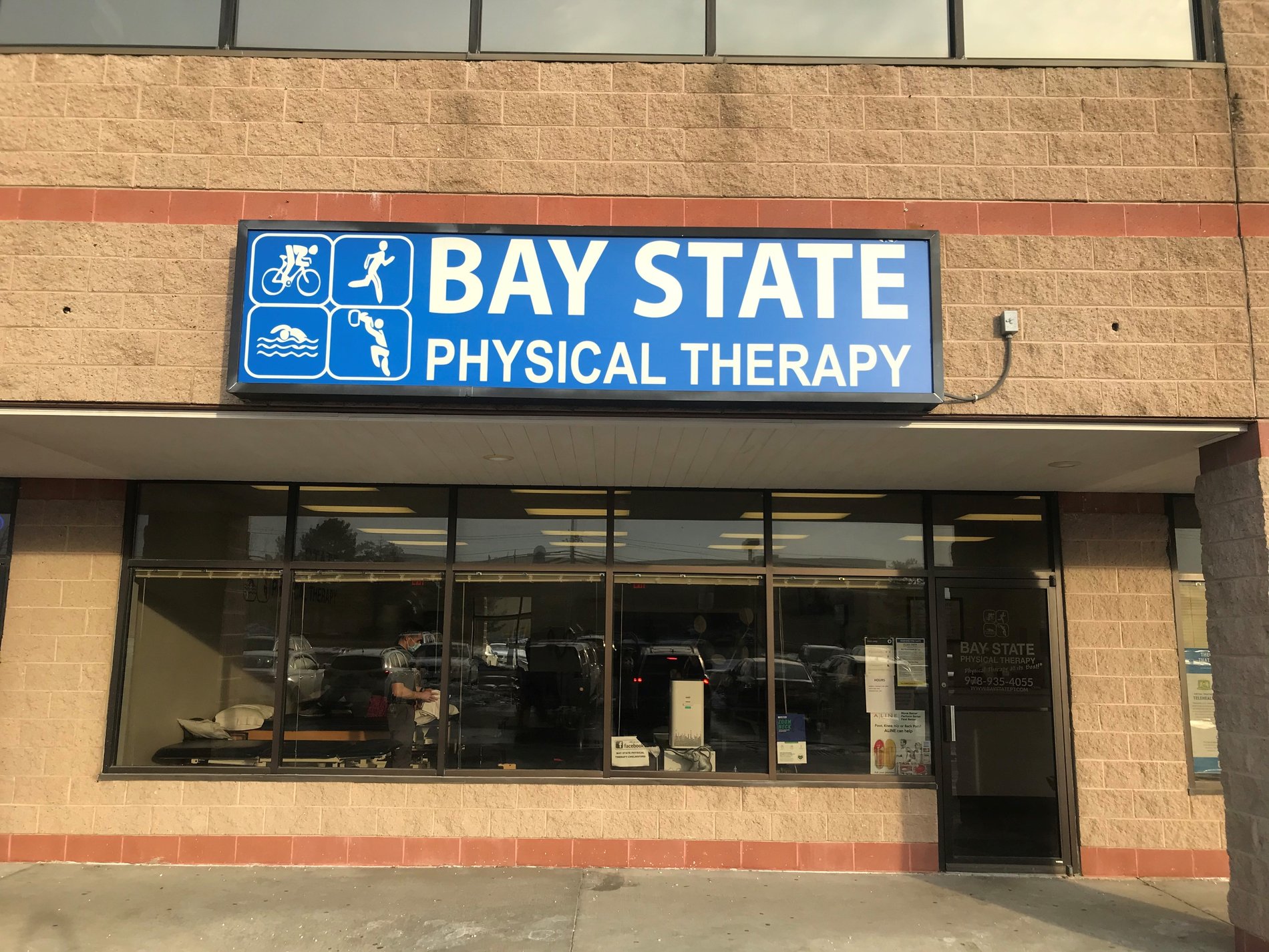 Bay State Physical Therapy Chelmsford, MA Parkhurst St. Front door with logo above the door.