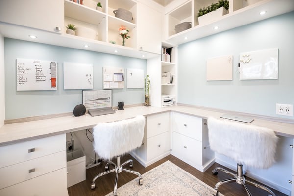 Custom built office workspace with storage and desktops for two people