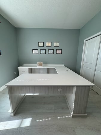 Office desk in Tuscan moon and washed white. Wire management and countertop overhangs.