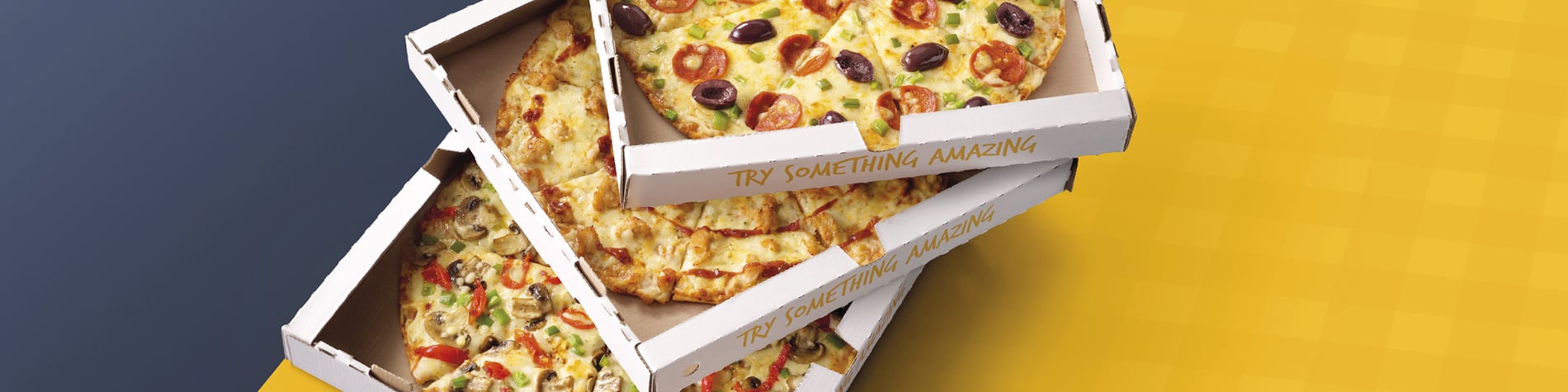 Group shot of Debonairs Pizza speciality pizzas – Cram-Decker®, Triple-Decker®, and Crammed-Crust® on boxes.