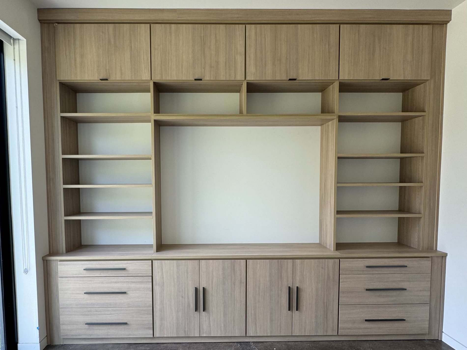 Brown media center with bookshelves Pensacola & Panama City, Florida