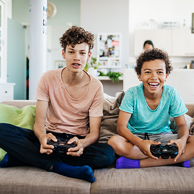 Teenagers gaming with fast internet services from Xfinity