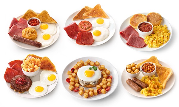 Three white plates side by side, each featuring halaal breakfast meals with smoked beef & eggs, hashbrown cubes, mielie bread flapjacks, a beef sausage, and a beef patty.