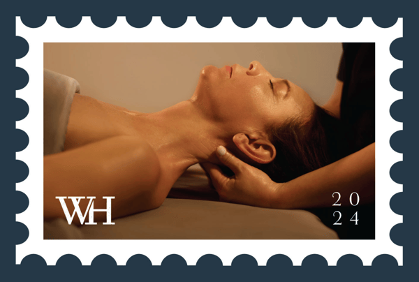 Woman receiving relaxing spa services at Woodhouse Spa.