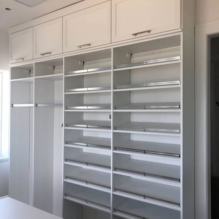 Richmond - Custom closets - Shoe shelves and racks to hang clothes in a walk-in closet