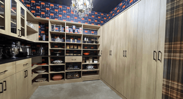 Img 9 - California Closets Hudson Valley New York Natural Wood Pantry with custom shelving to hold pots, pans, canned goods and spices and closed cabinet doors to hold kitchenware and cleaning supplies