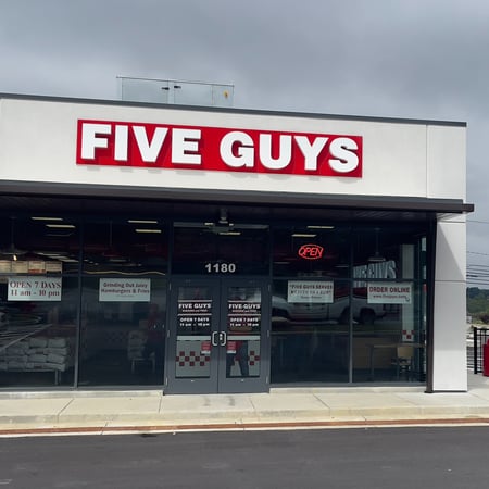 Exterior photograph of the Five Guys restaurant at 1180 N. Central Avenue in Somerset, Pennsylvania.