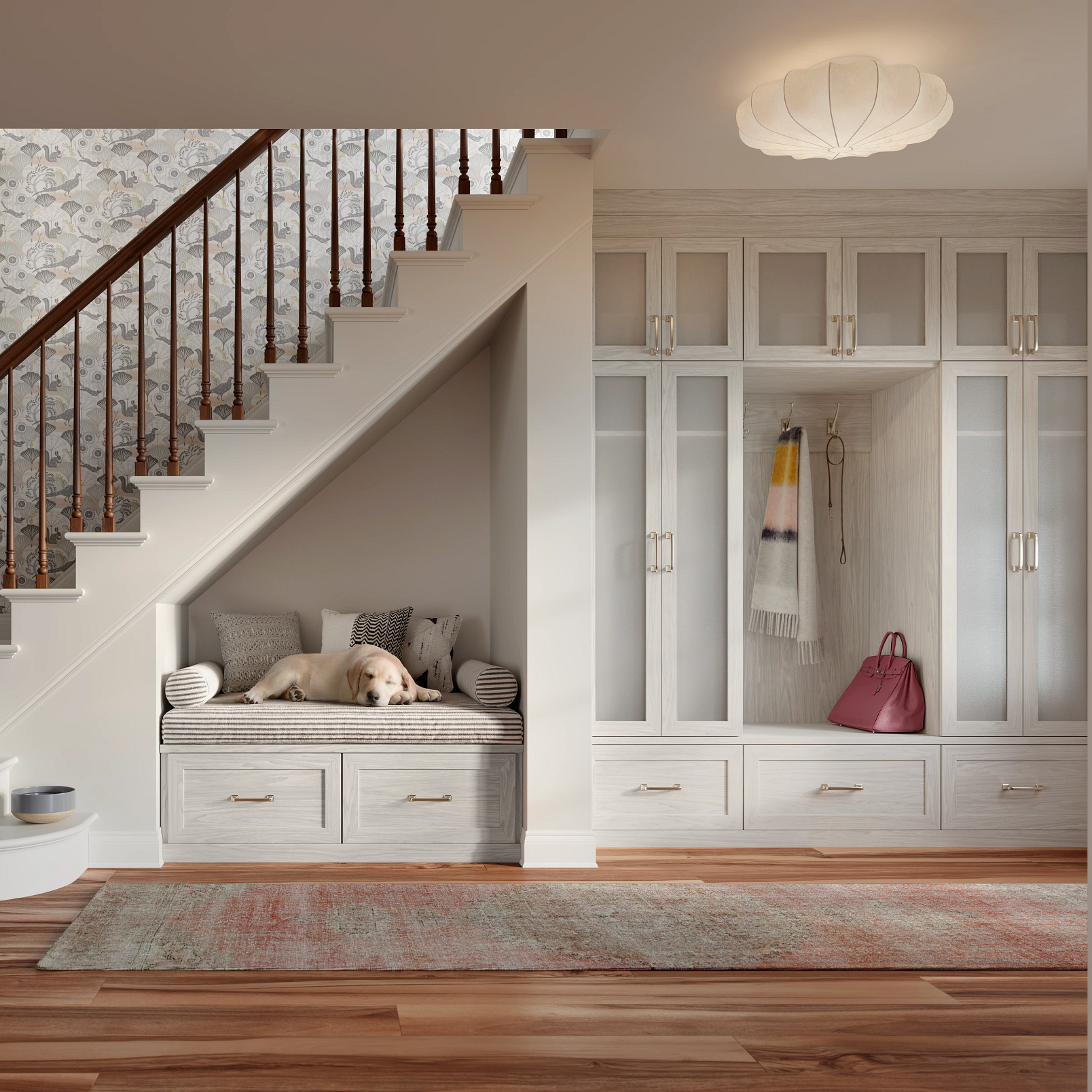 Light-toned entryway closet with bench under stairs by California Closets Greenwich, Connecticut.