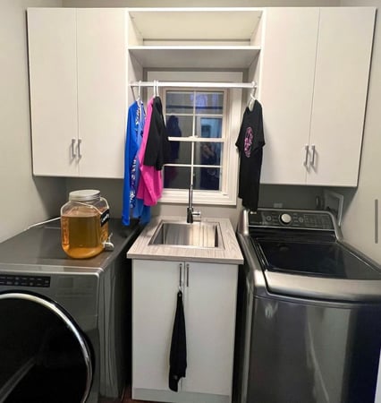 Small space with tricky measurements. Laundry room with sink and hanging.