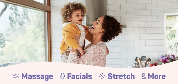Image of woman holding a child. Massage Facials Stretch and More
