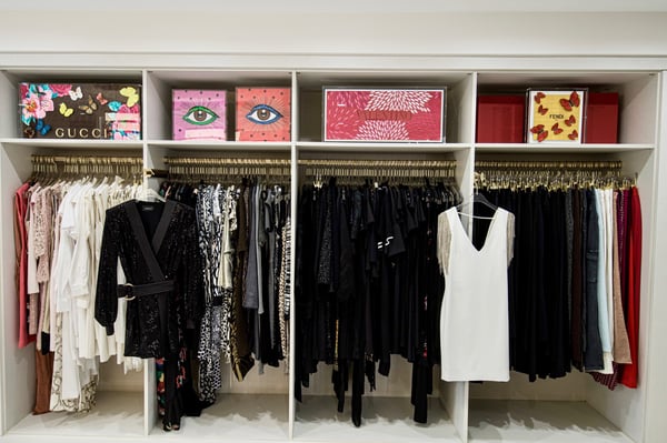 White closet organization with gold hanging poles California Closets New Orleans & Gulf Coast Louisiana.