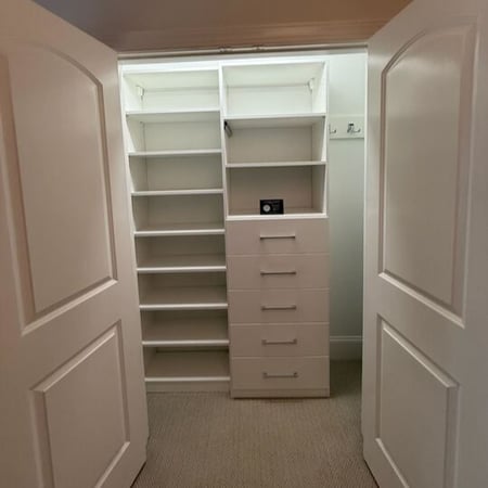 Wilmington - Custom closets - Double-door reach-in closet with white shelving and drawer tower.