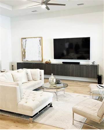 Modern Contemporary floating media center with tv and wall art by California Closets St. Petersburg, Florida.