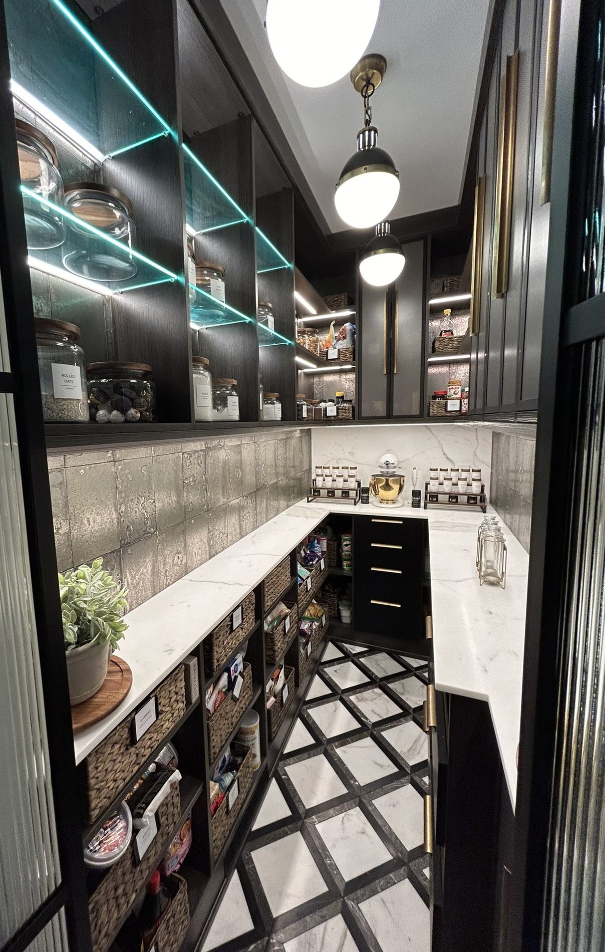 A luxury pantry with lighting and elevated finishes