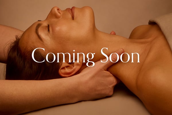 Woman receiving a relaxing facial treatment at Woodhouse Spa in Wilmington, North Carolina.