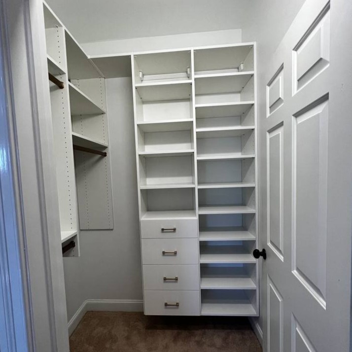 Greensboro - Custom closets - walk-in closet with white shelving, hanging rods, and drawers in a compact layout
