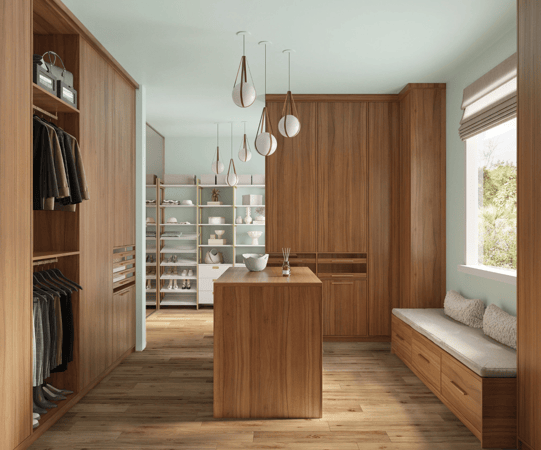 Luxurious walk-in closet by California Closets Austin, featuring custom wardrobe doors, drawers, bench seating, and a central island for optimal organization and style.