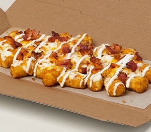 Cheddar Bacon Loaded Tots Tots - Golden brown potato tots topped with smokey bacon, a blend of cheese made with mozzarella and melty cheddar, and garlic Parmesan sauce.