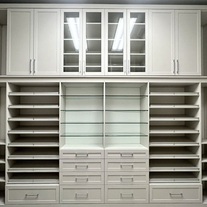 Custom closet organization with drawers shoe shelving and purse display California Closets by California Closets Baton Rouge, Louisiana.
