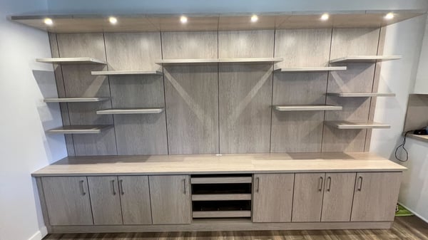 Custom built locally made media center in neutral tone by California Closets San Diego, California.