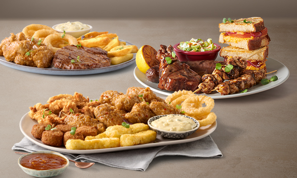 Lunch meals from Mugg & Bean Wonderpark including a Rump, Wings & Rings meal, a Local Braai Plate with boerewors, steak, chicken sosaties, and a toasted sandwich, and a Sharing Platter with halloumi, chicken strips, dipping sauces and more.